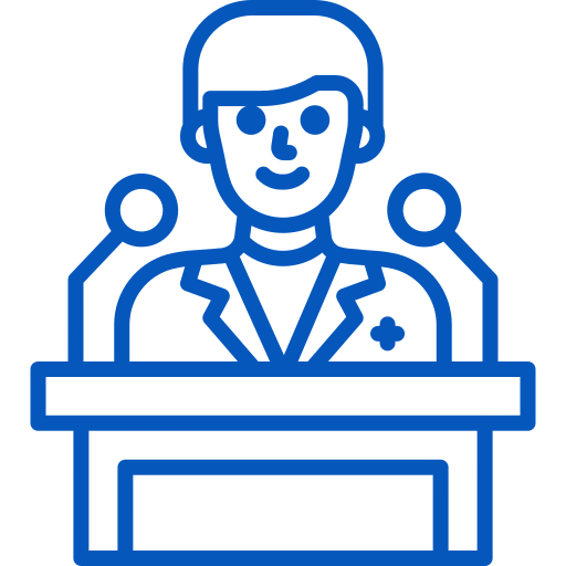 Medical Conferences Spoken At Person in a suit giving a speech at a podium with two microphones